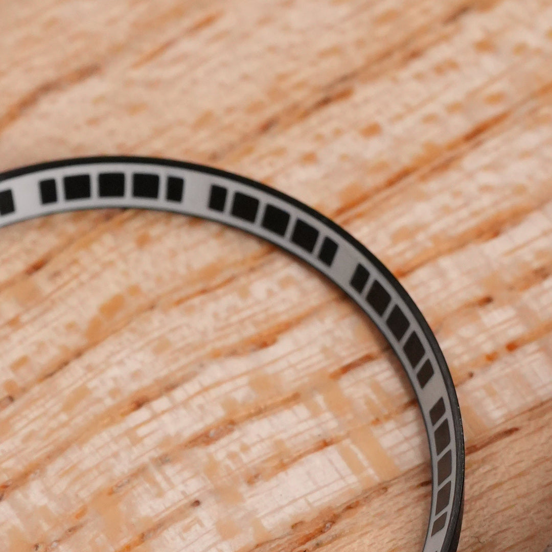 SKX007/SRPD Matrix Chapter Ring: Brushed Black with Lume — macro detail, close-up crop of the original product photograph