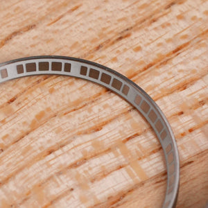SKX007/SRPD Matrix Chapter Ring: Brushed Silver with Lume — macro detail, close-up crop of the original product photograph