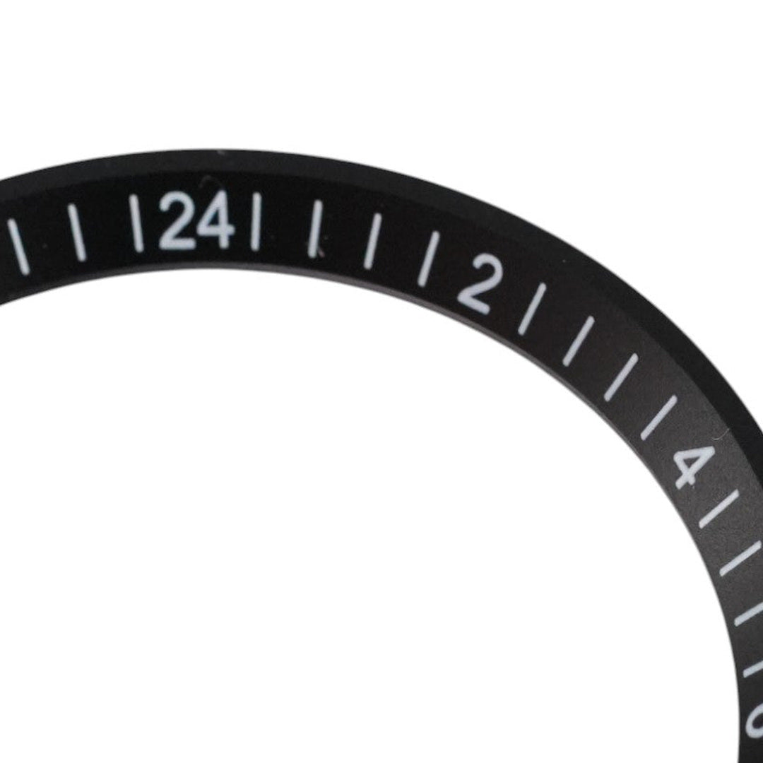 SRPE Chapter Ring GMT: Black with White Numerals — macro detail, close-up crop of the original product photograph